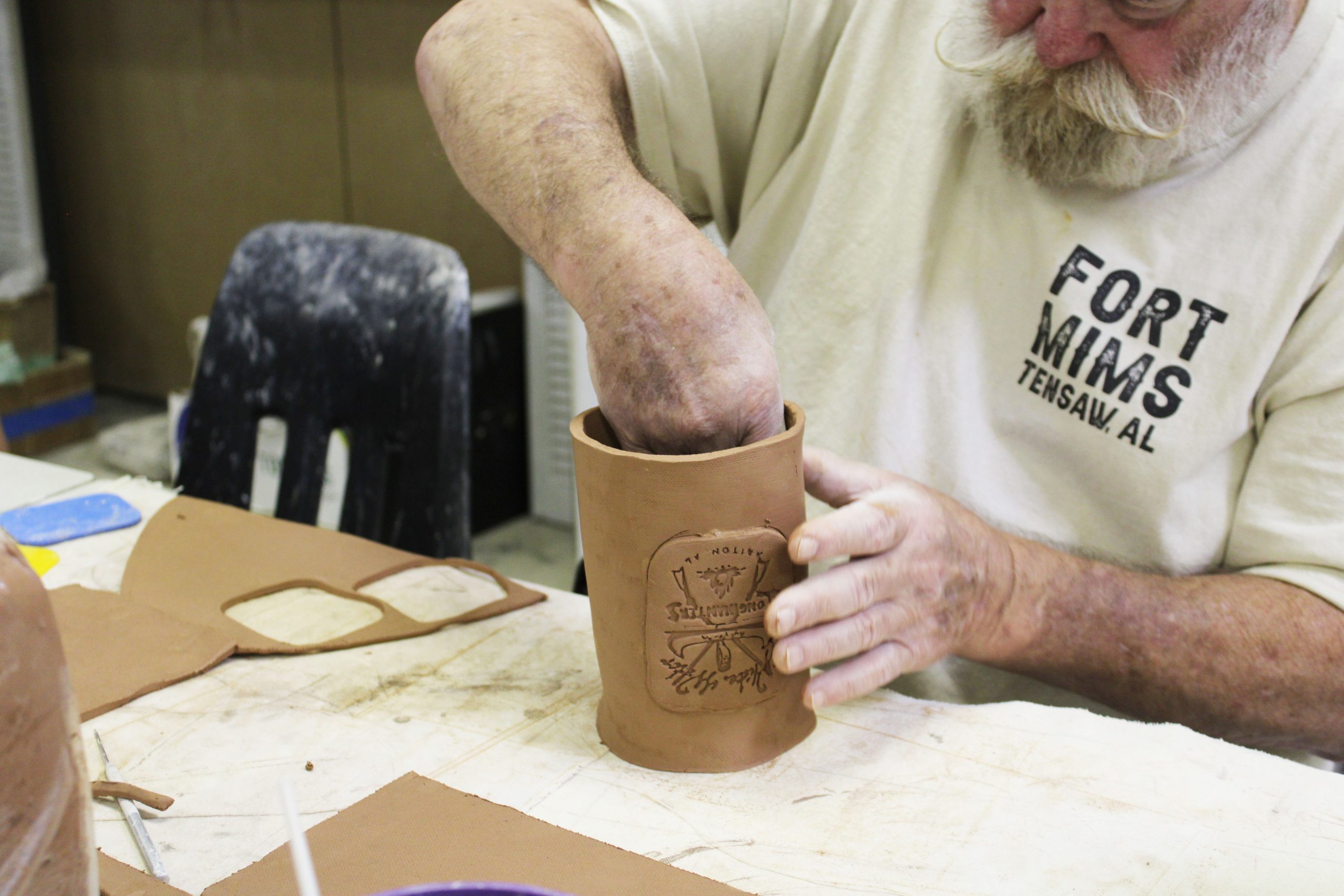 Man building mug.